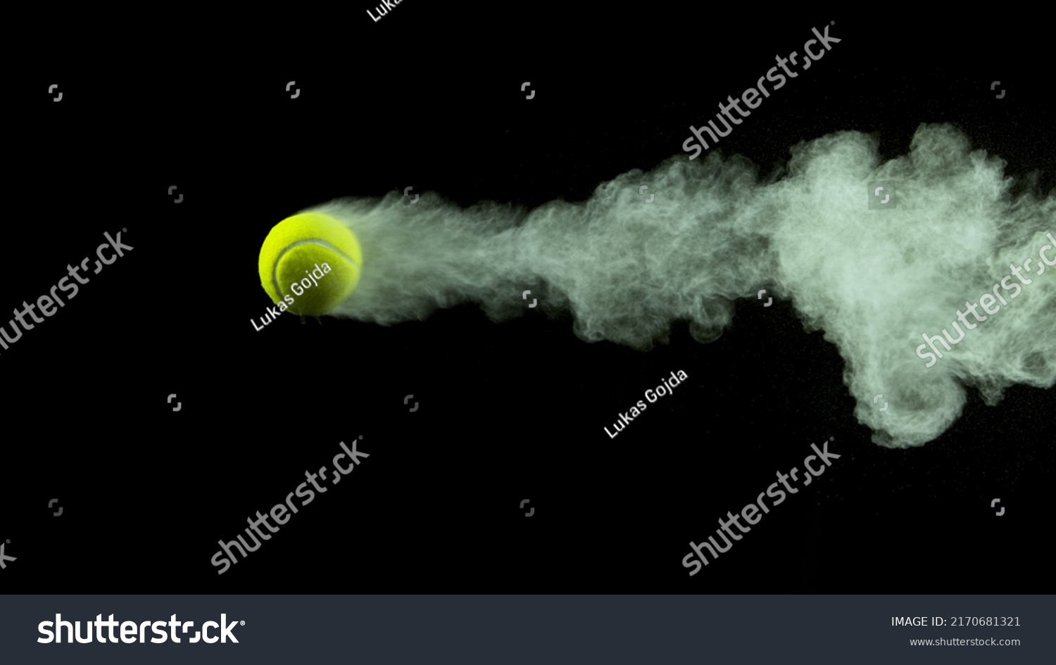 Freeze Motion Shot of Flying Tenis Ball Containing Light Green Powder #2170681321