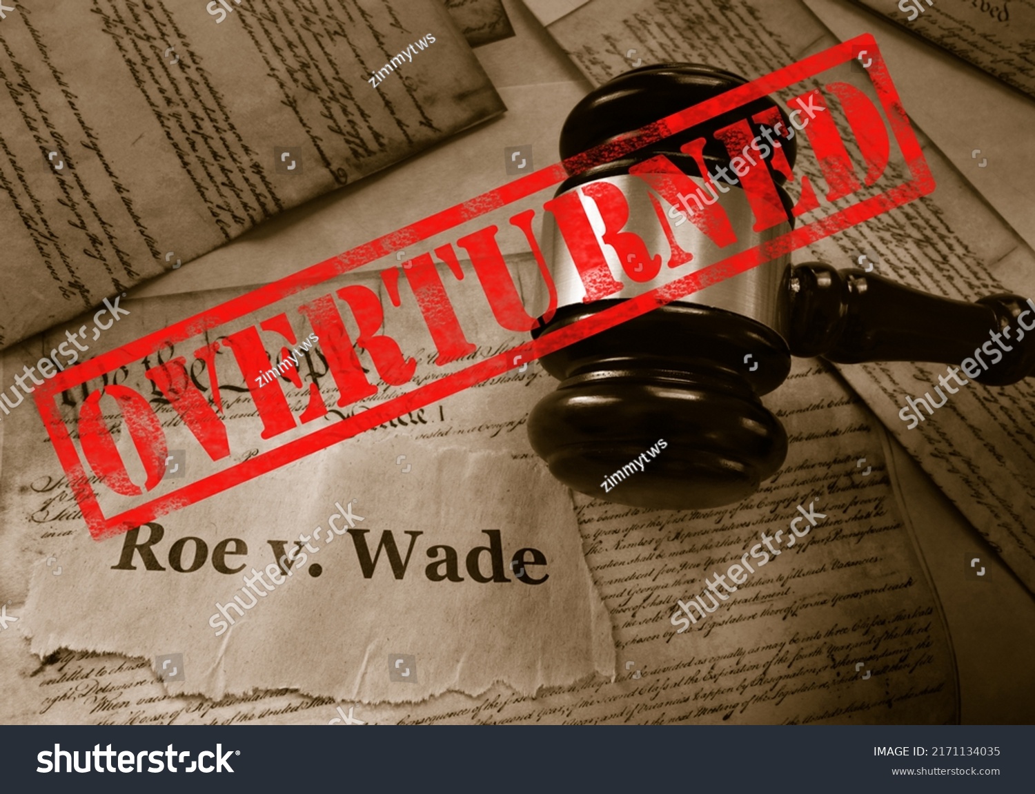  Roe v Wade news headline with gavel and Overturned stamp on a copy of the United States Constitution                               #2171134035