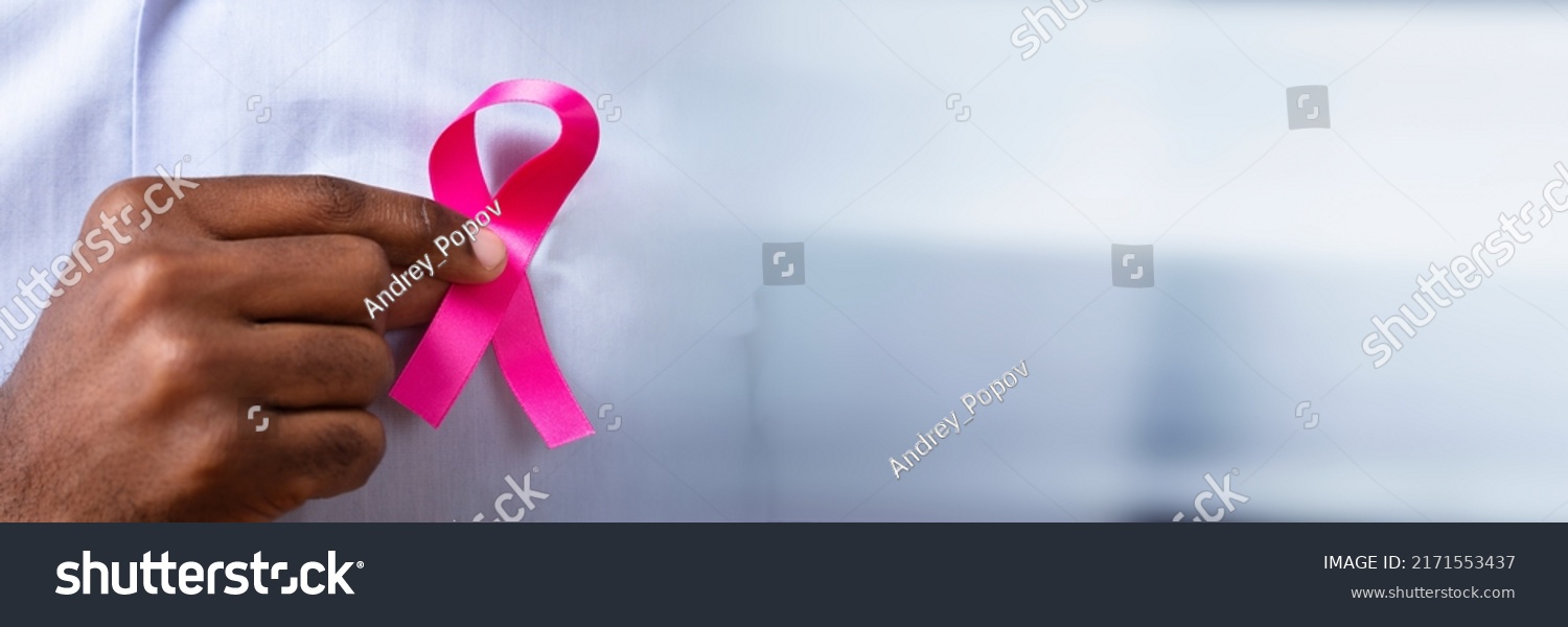 Man's Hand With Pink Ribbon Supporting Breast Cancer Cause #2171553437