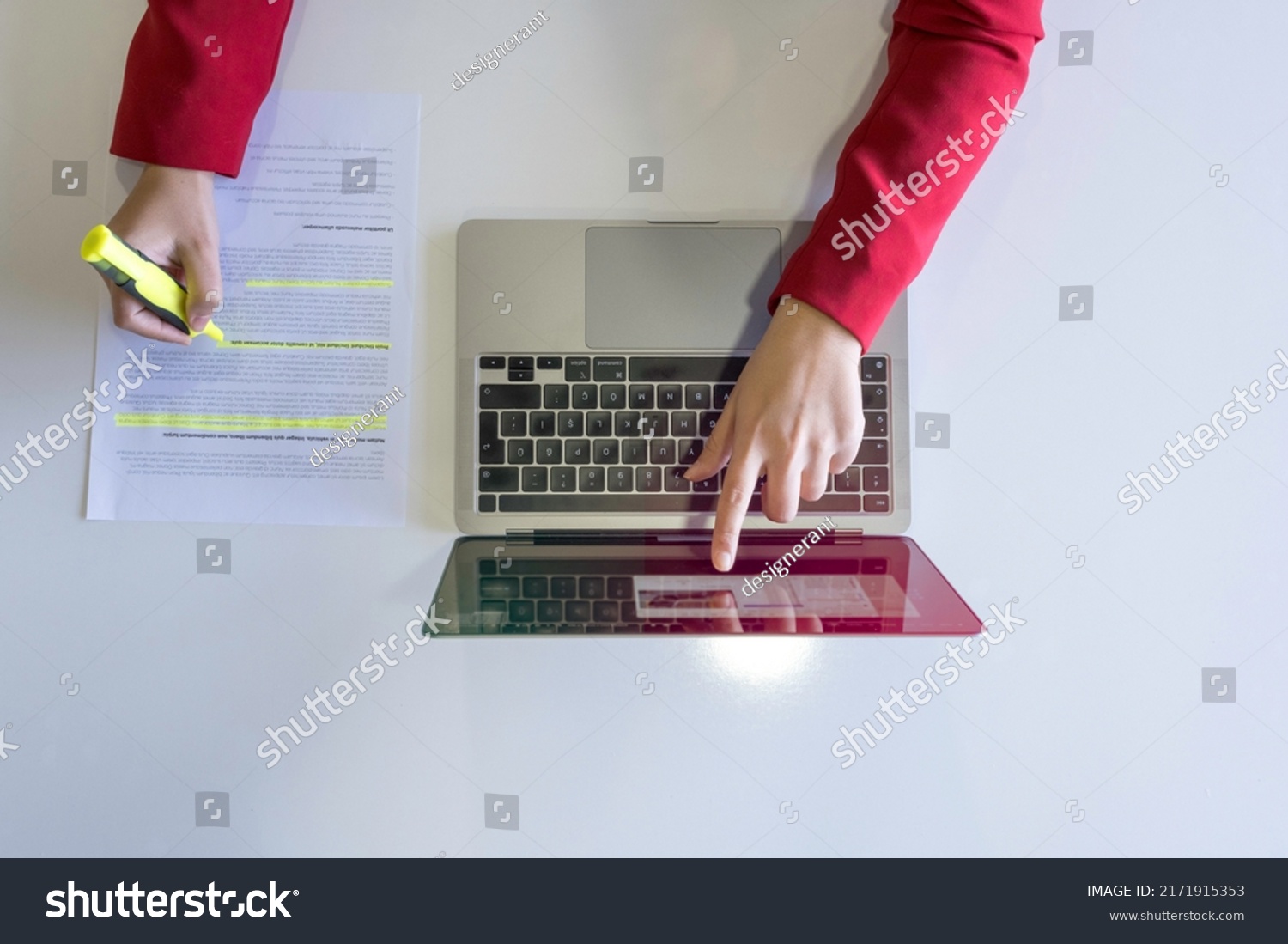Holding highlighter pen, top view of woman hand holding highlighter pen. Working on laptop and highlighting or marking important text on working paper, isolated on white desk. #2171915353