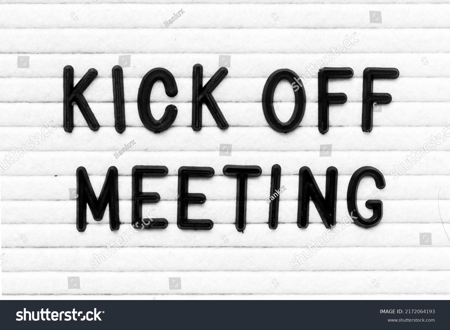 Black color letter in word kick off meeting on white felt board background #2172064193