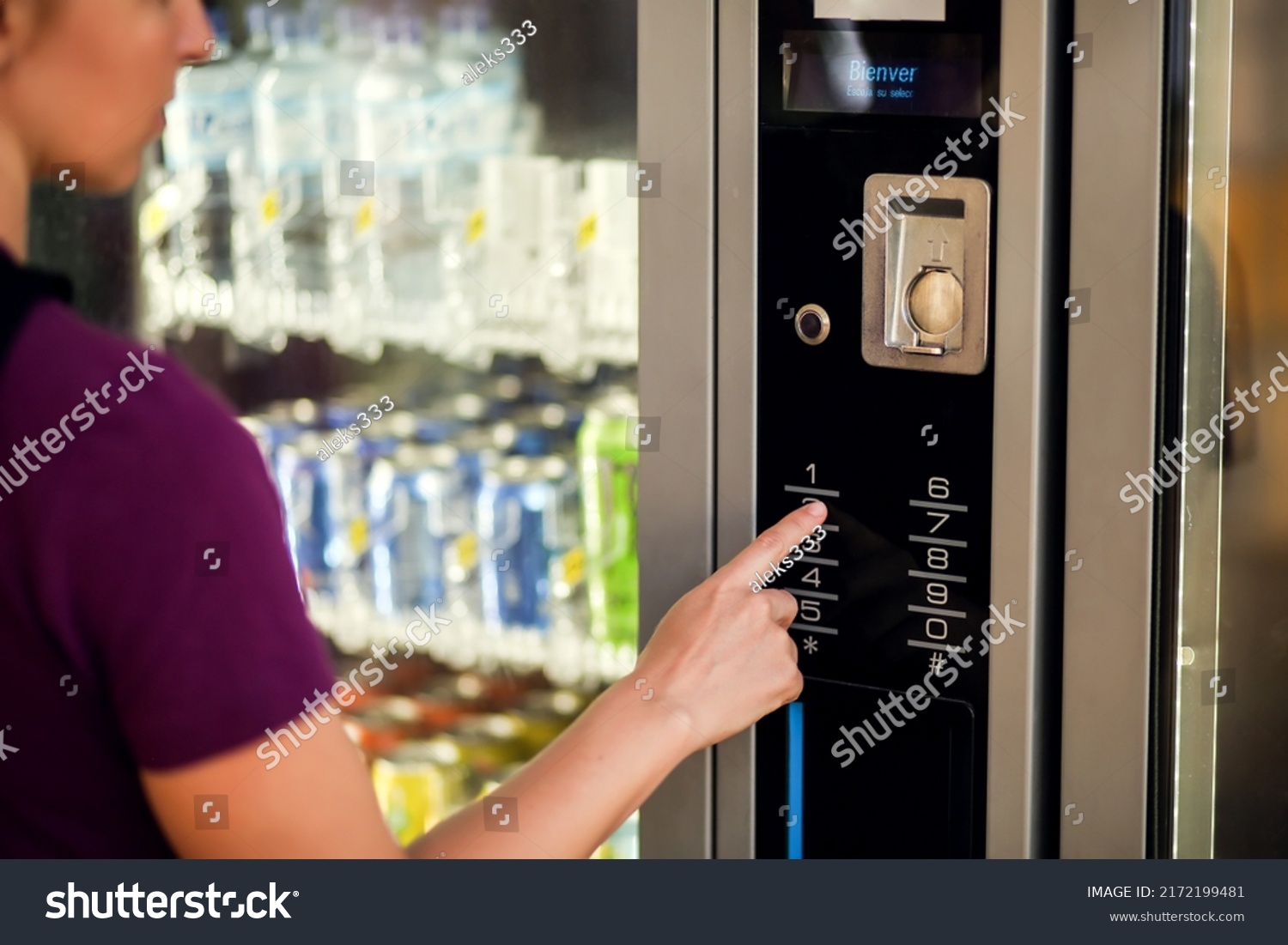 Hand presses button of vending machine pannel. Self-used technology and consumption concept #2172199481