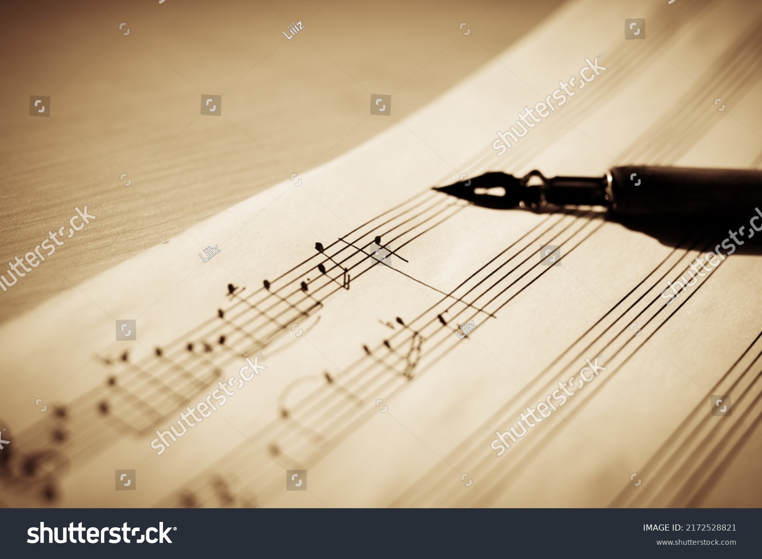 Sheet music on a sheet music stand with an ink pen in the background, macro notes, selective focus #2172528821