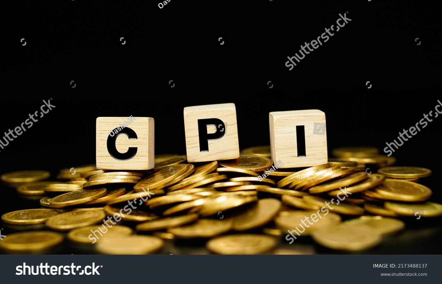 CPI, Stacks of gold coins with the letters CPI (Consumer Price Index) on a wooden cube. Business concept. #2173488137