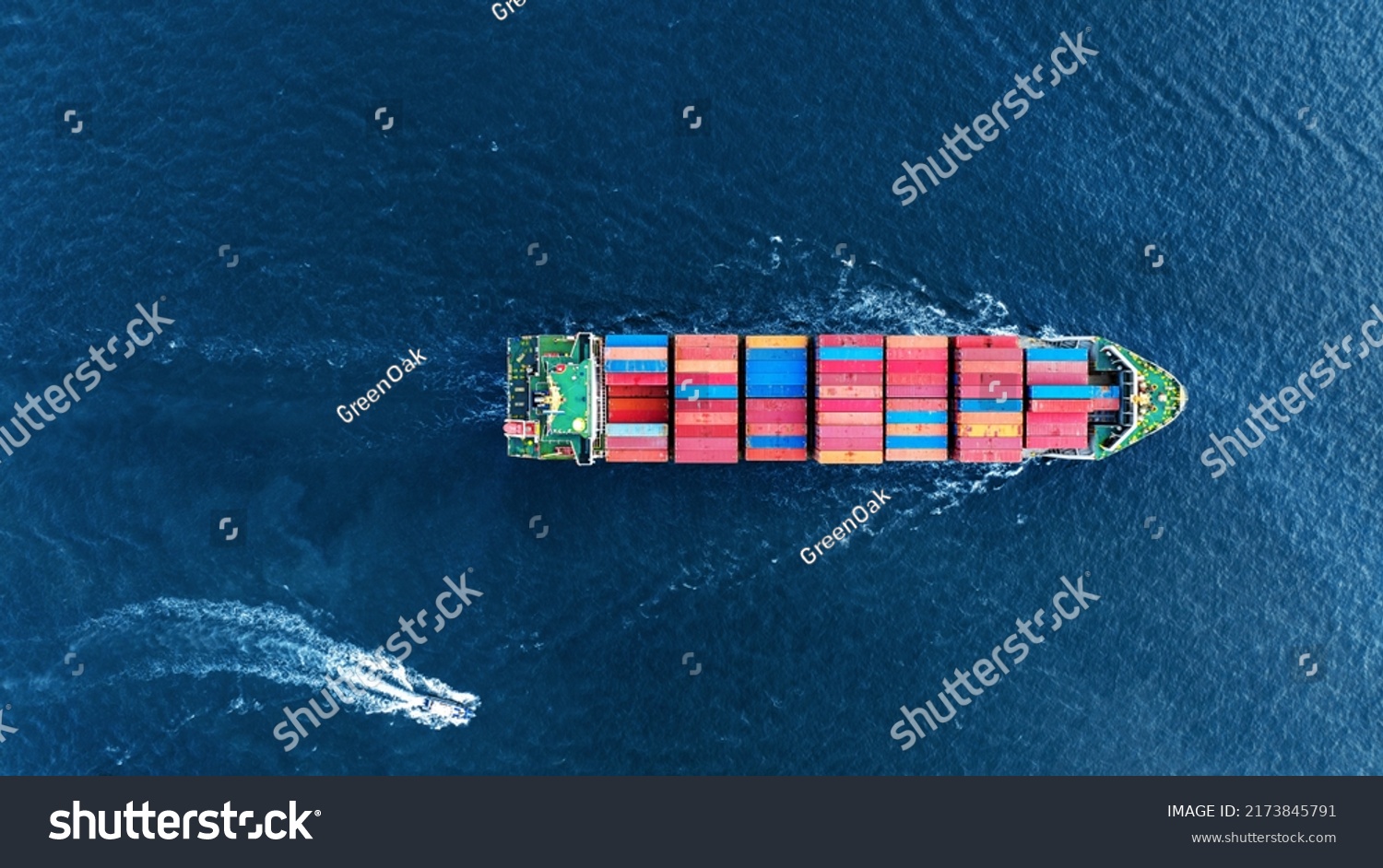 Aerial top view of cargo ship carrying container and running with Pilot Boat for export goods from cargo yard port to custom ocean concept technology transportation logistic trader blobal  forwarder  #2173845791