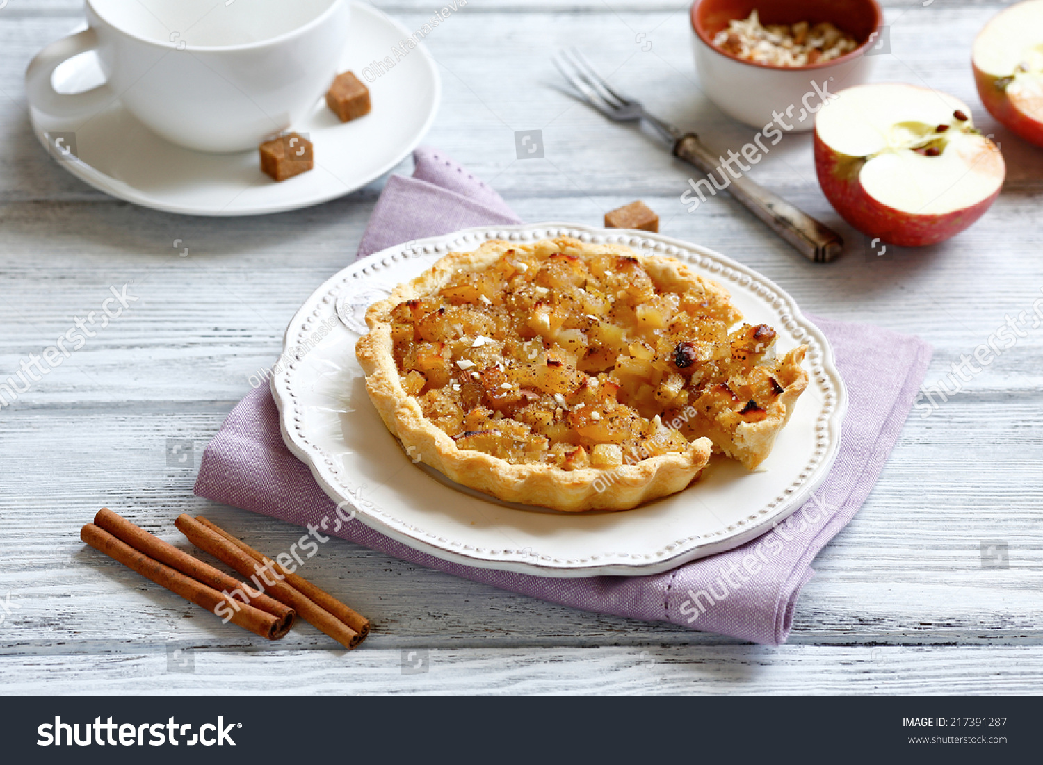 Crispytart with apples and sugar on white plate #217391287