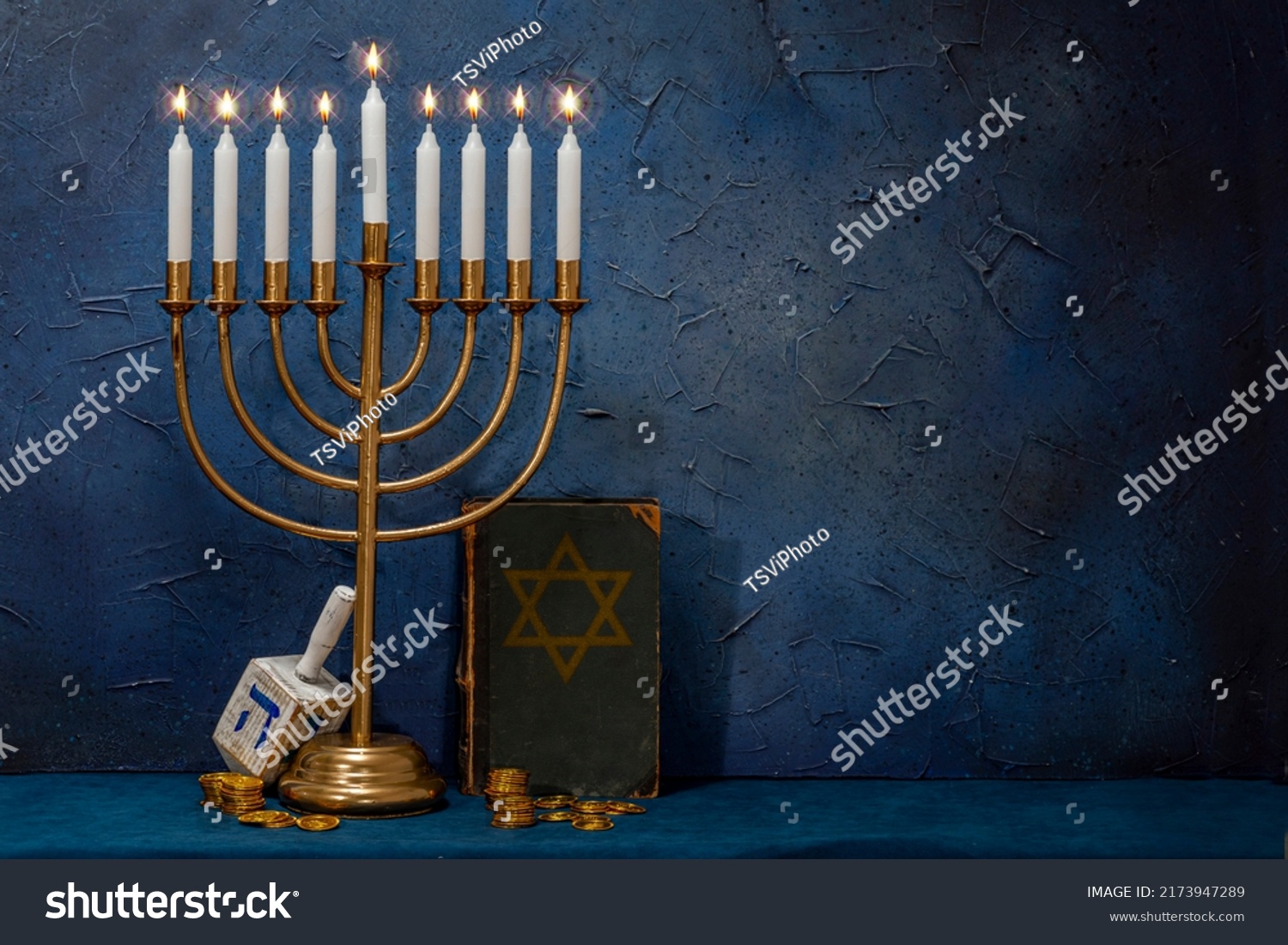 Jewish Hanukkah Menorah, book with star of David, dreidel. Holiday Candle Holder, dreidl, Talmud, or Torah. Nine-arm candlestick. Traditional Hebrew Festival of Lights candelabra. Сopy space. #2173947289