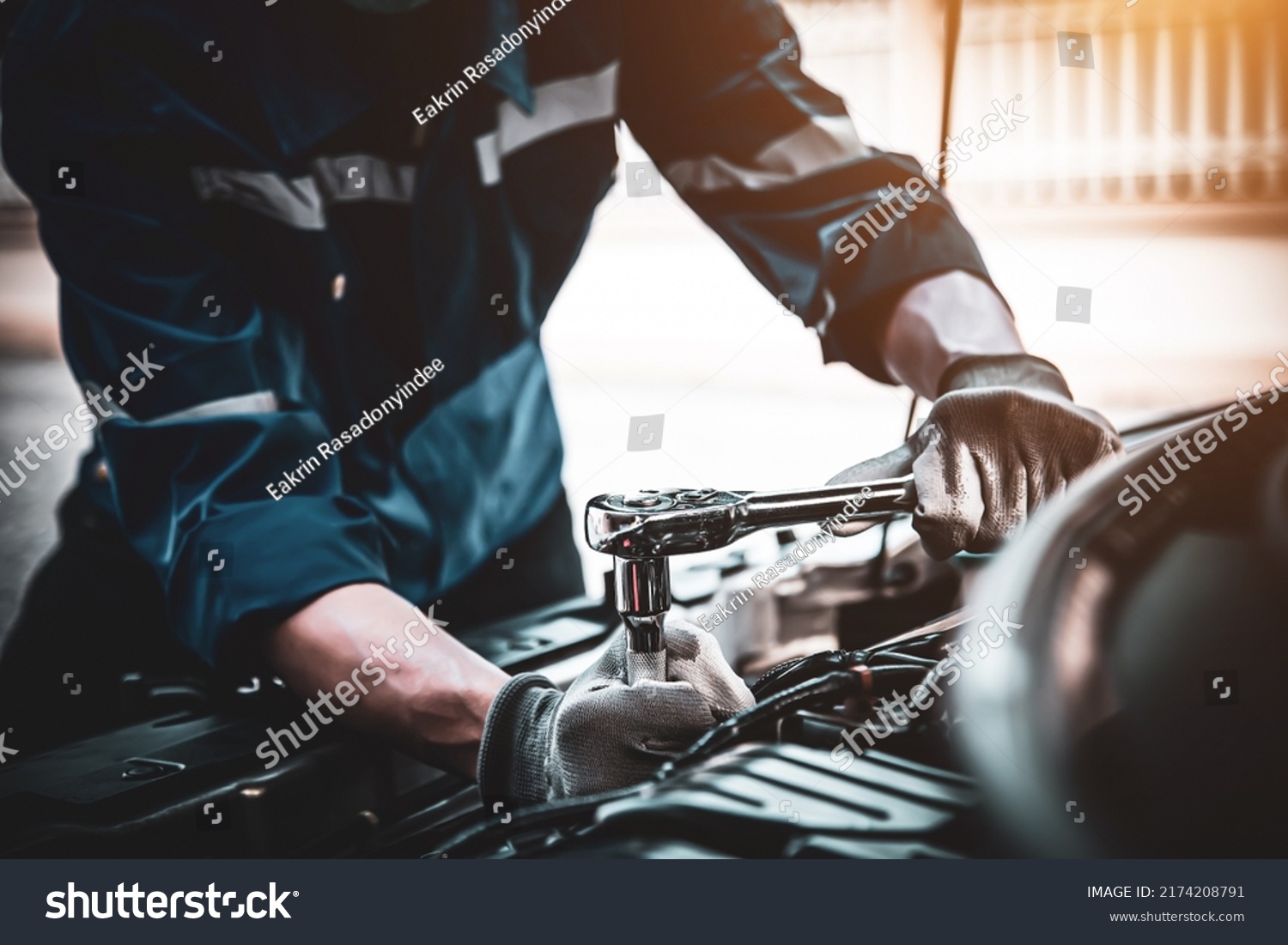 Car care maintenance and servicing, Close-up hand technician auto mechanic using the wrench to repairing change spare part car engine problem and car insurance service support. #2174208791