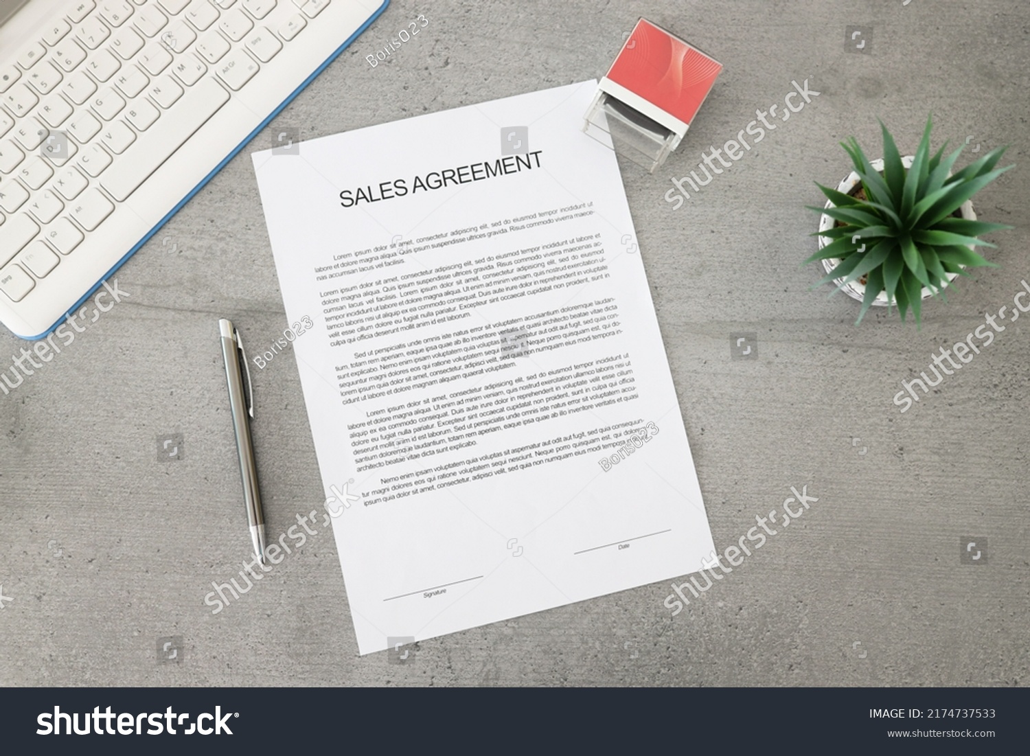 Business document paper of sale agreement. Waiting to sign sales agreements on a desk with a pen, stamp, and plant. Business contract. #2174737533