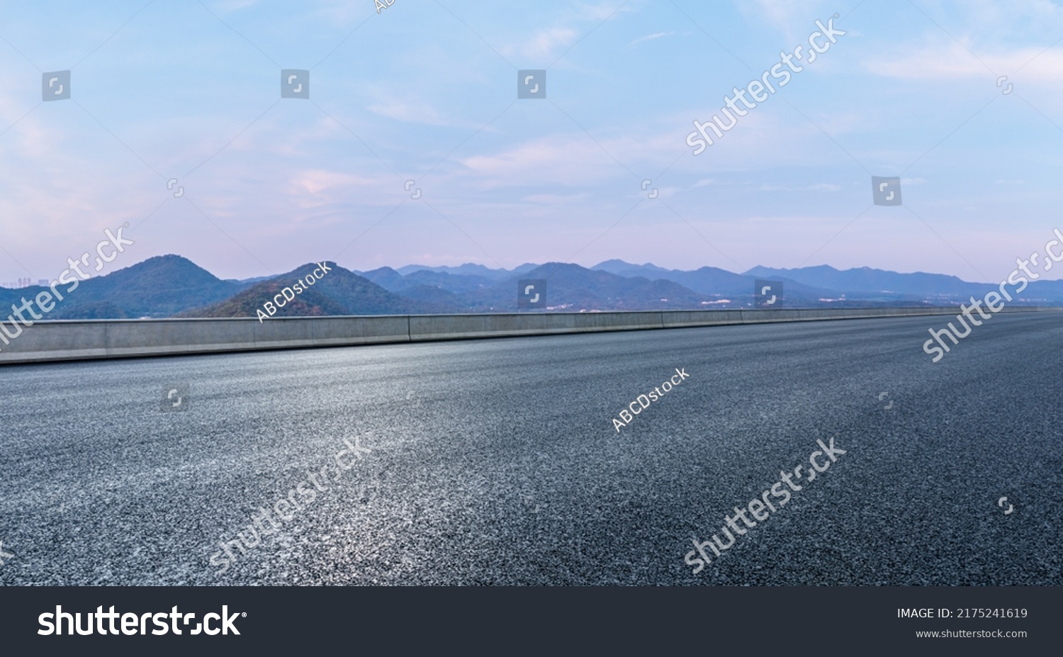 Asphalt road and mountain natural scenery at dusk #2175241619