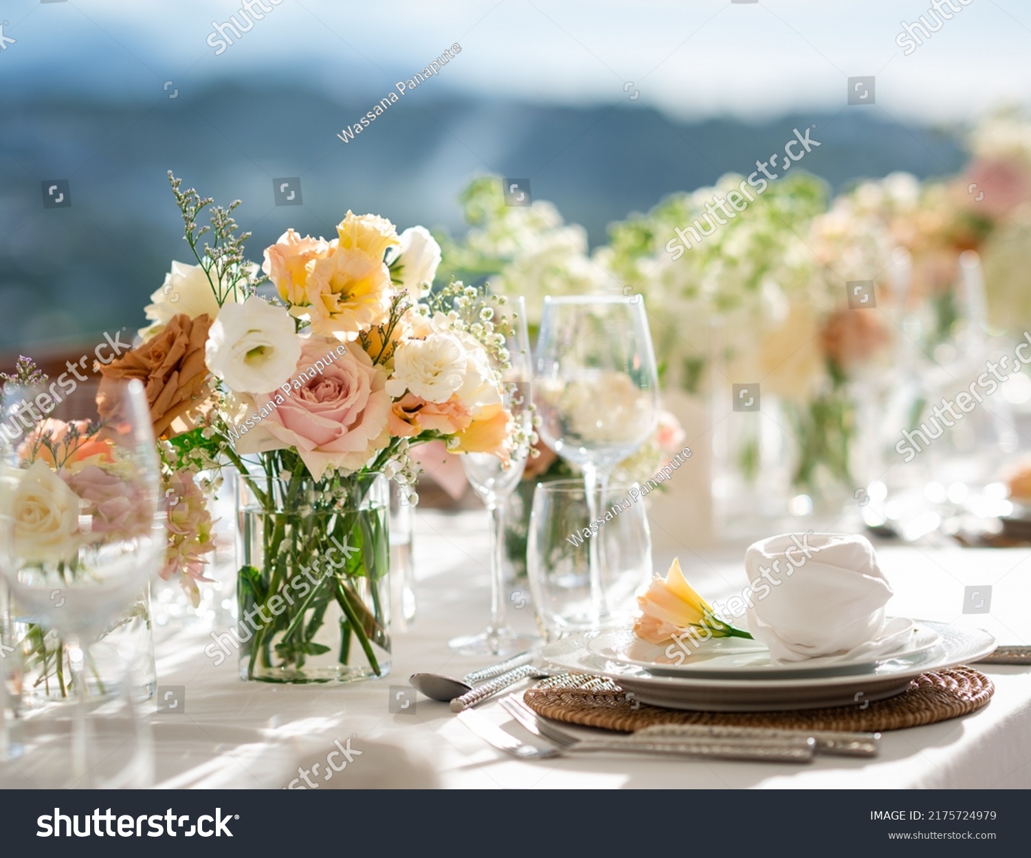 Beautiful flowers decorated on the table.Tables set for an event party or wedding reception. luxury elegant table setting dinner in a restaurant. glasses and dishes. Fancy moment fancy time. #2175724979