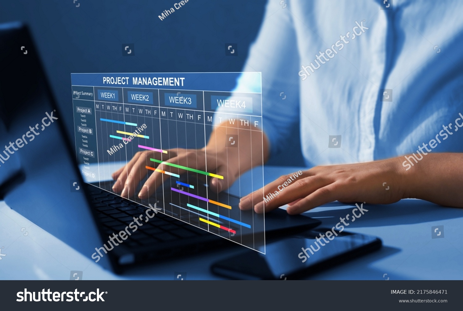 Project manager working on laptop and updating tasks and milestones progress planning with Gantt chart scheduling interface for company on virtual screen.  Business Project Management System.  #2175846471