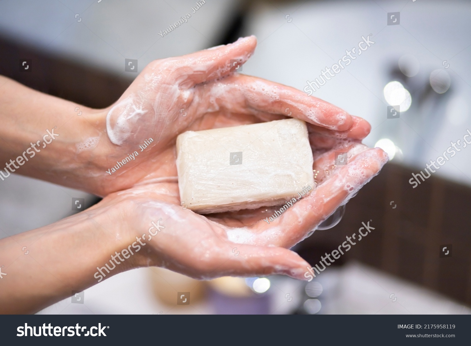 Closeup on young woman hands with soap bar #2175958119