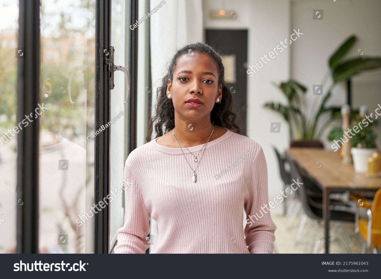 Confident beautiful African woman professional with serious face standing at home in office looking at camera. Confident entrepreneur lady posing alone, head shot close up view portrait #2175961043