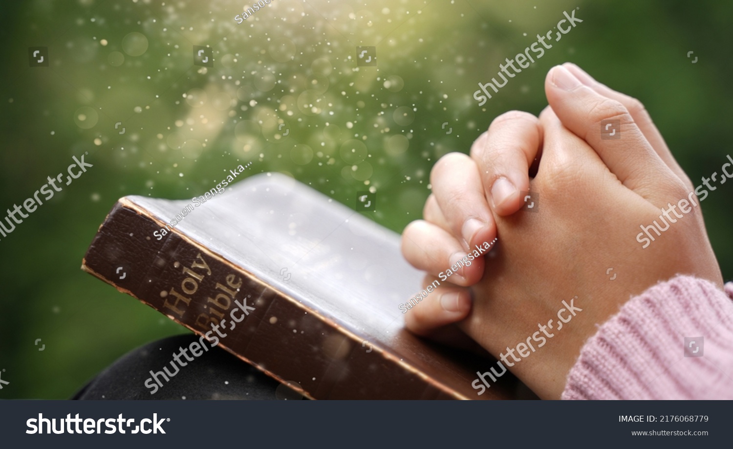 Christian Crisis Prayer to God Man praying to God for a better life human hands praying to god with bible believe in good Hold hands and pray. #2176068779