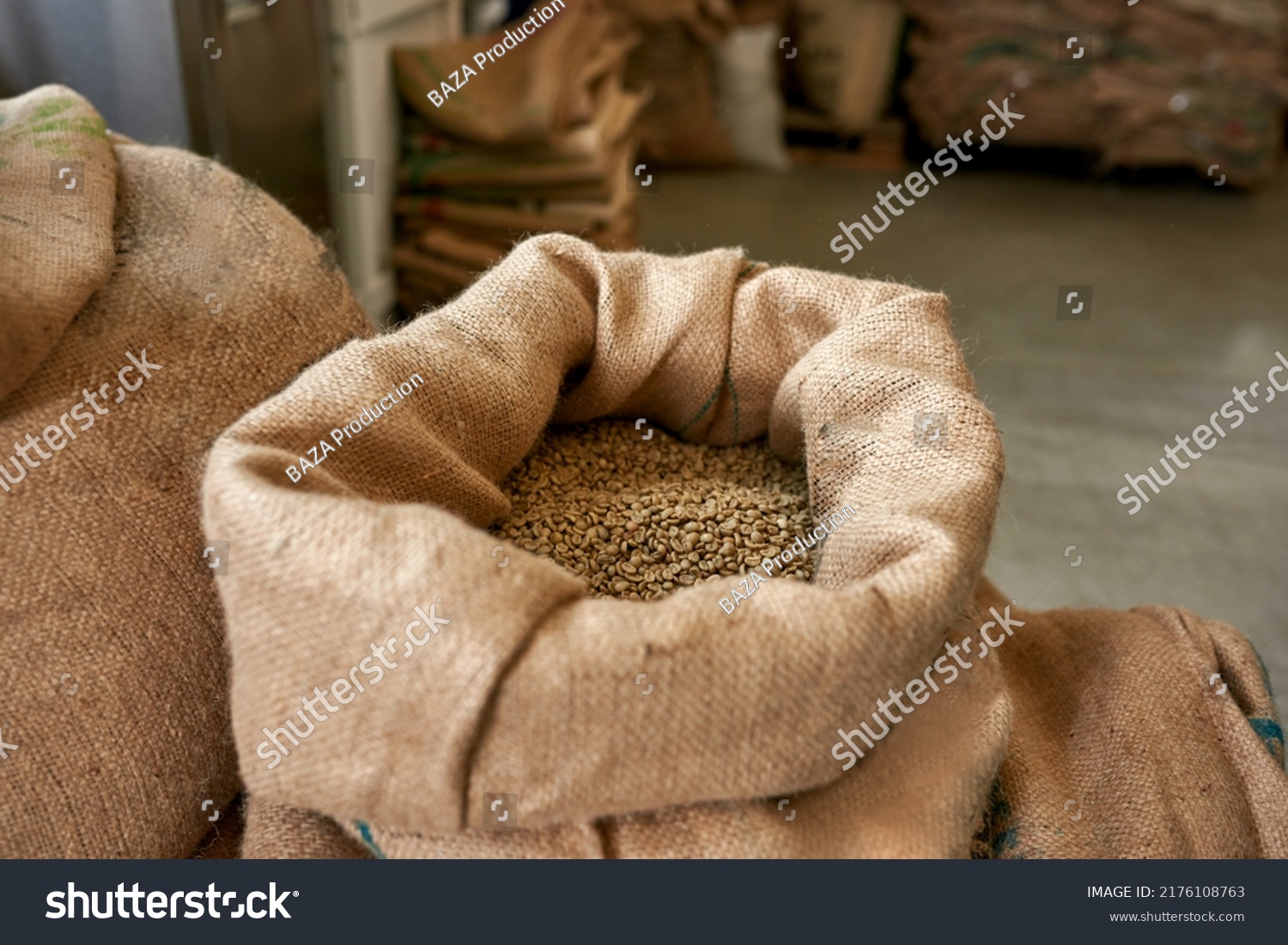 Textile sack full of fresh organic natural aromatic green coffee beans on factory or warehouse. High quality agriculture grains for coffee making and production. Coffee seeds for export. Nobody #2176108763