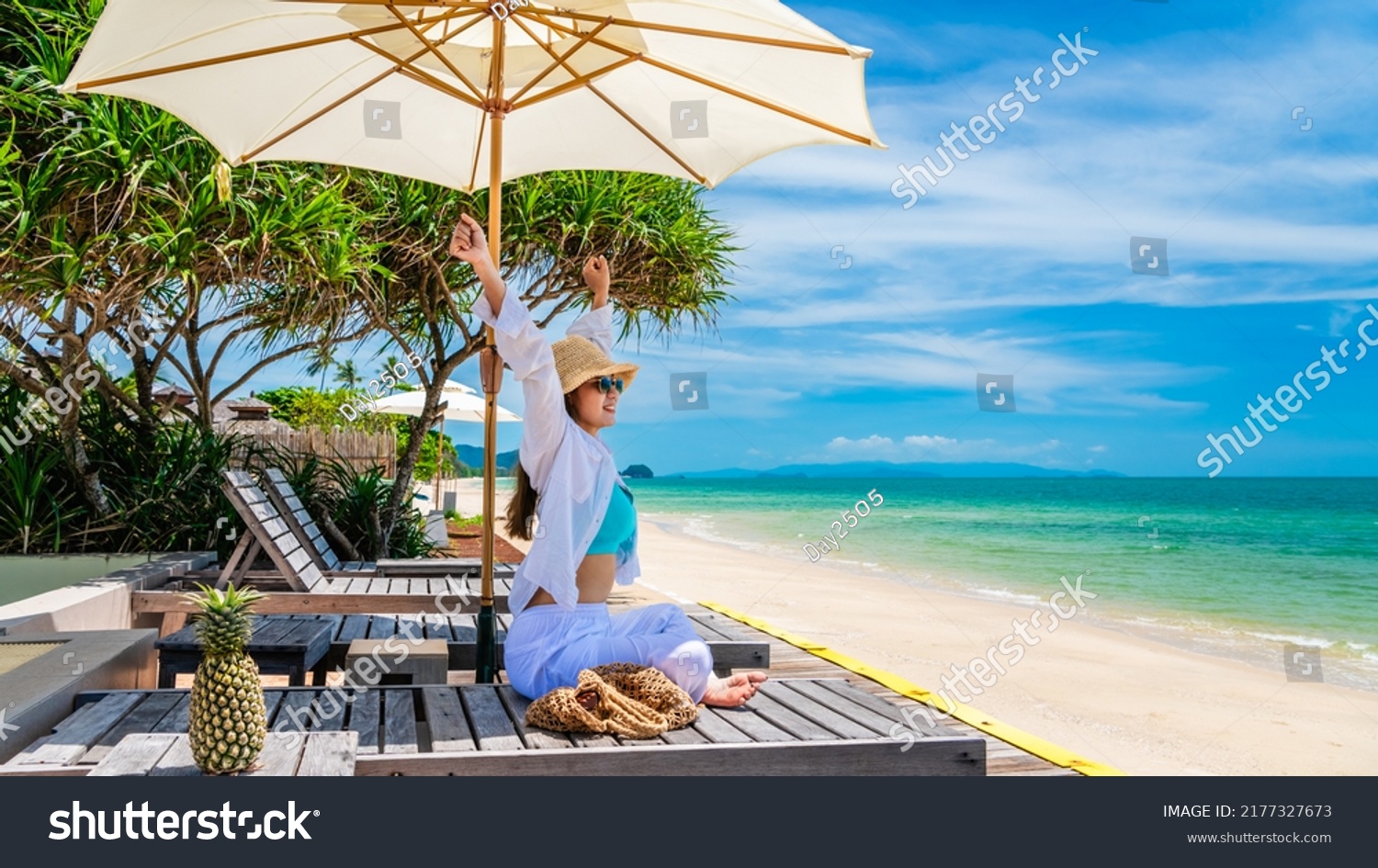 Happy traveler woman relaxing under umbrella joy fun nature view scenic landscape beach, Leisure time tourist travel Phuket Thailand summer holiday vacation, Tourism beautiful destination place Asia #2177327673