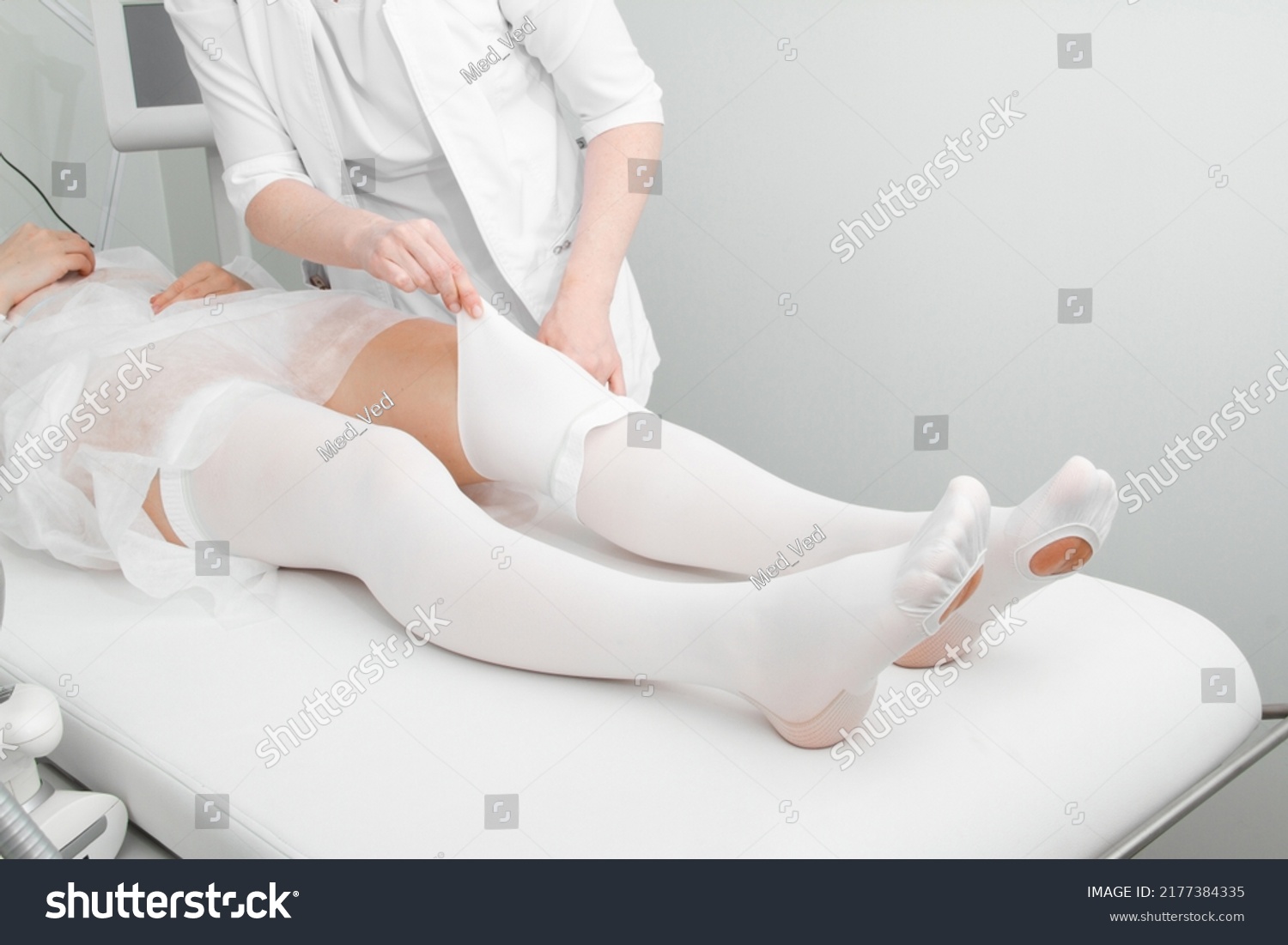 Anti-embolic Compression Hosiery for surgery isolated on white. Medical white stockings, tights for varicose veins and venouse therapy. Thrombo embolic deterrent hose or anti-embolism stockings. #2177384335
