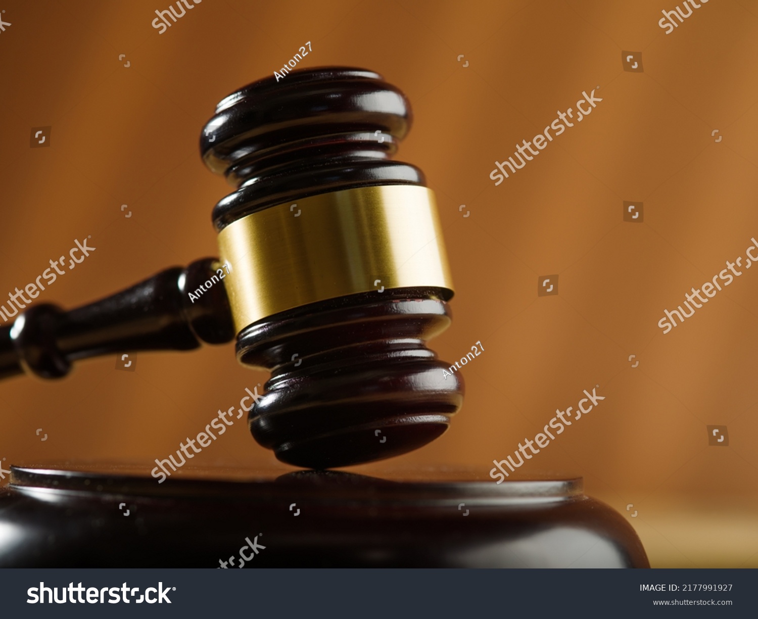 Close-up. Wooden judge's gavel on a beige background. Court, justice, presumption of innocence, Constitution, rule of law, auction. Banner, poster. There is no one in the photo. #2177991927