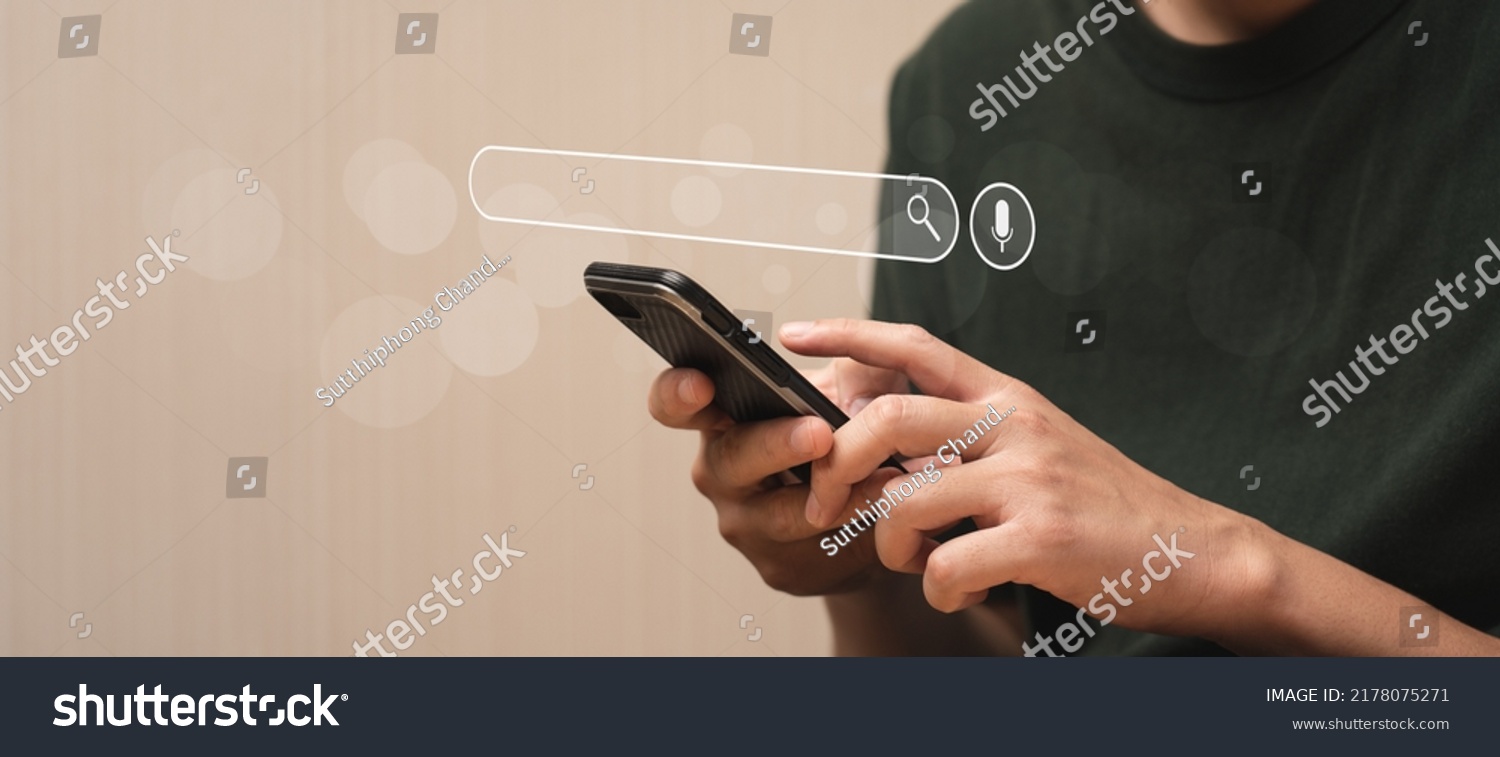 Search Engine Concept. Tools or programs for searching for information on the Internet. Man's hand using mobile phone to search for information using Search Engine and help your online business grow. #2178075271
