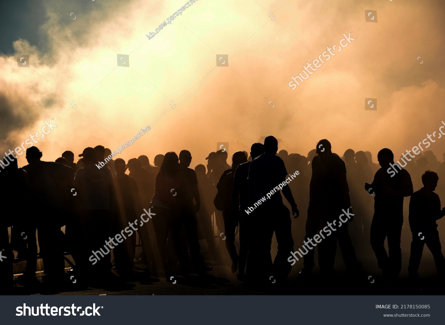 People silhouette with heavy smoke from burnt tyres on drift contest, concept of people on drift car event #2178150085