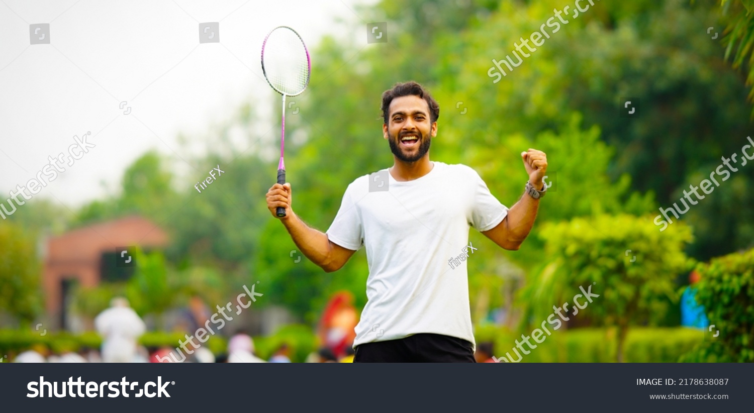 Portrait of badminton player holding badminton racket hd image #2178638087