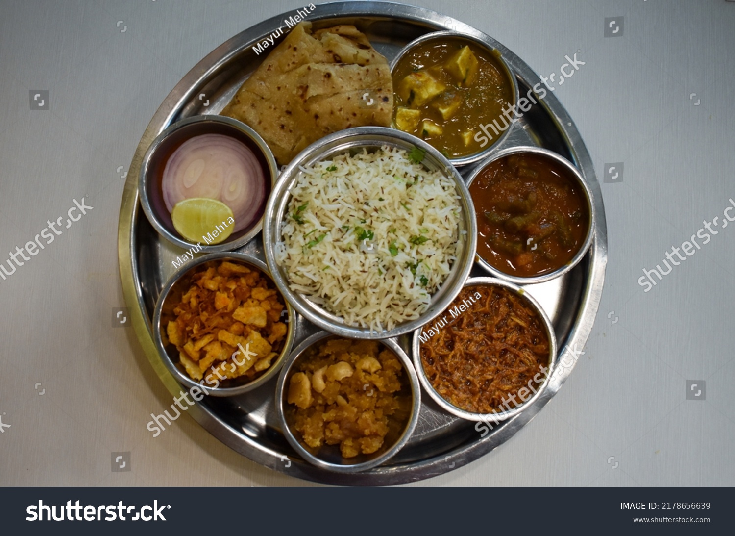 Indian food. Rajasthani Thali. Veg Full main course meal India. Maharaja Thaali. Veg Thali from an indian cuisine. Marwadi Dishes. Indian Traditional Thali Food.  #2178656639
