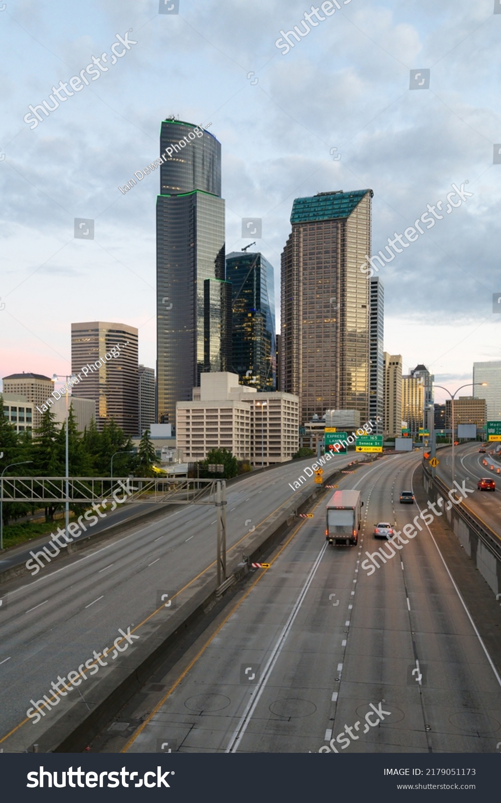 City of Seattle skyline at dawn with Interstate 5 and a few vehicles in the early morning #2179051173
