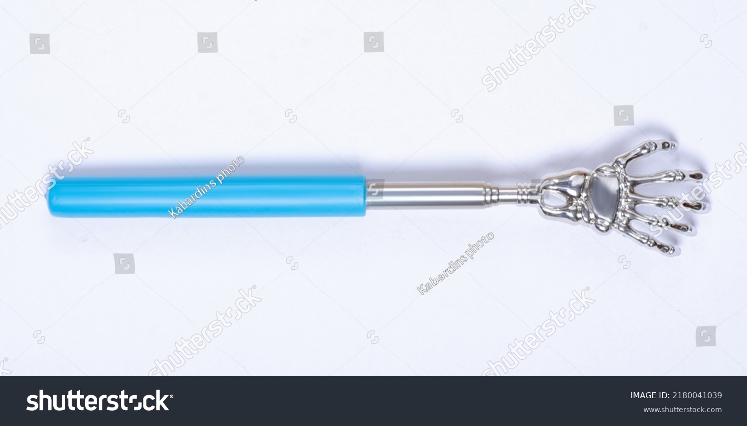 Metal back scratcher on white background isolation, top view #2180041039