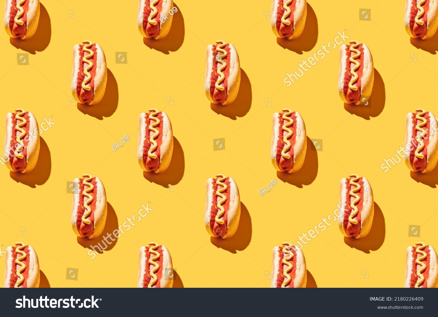Pattern of fresh made hot dogs on yellow pastel background #2180226409