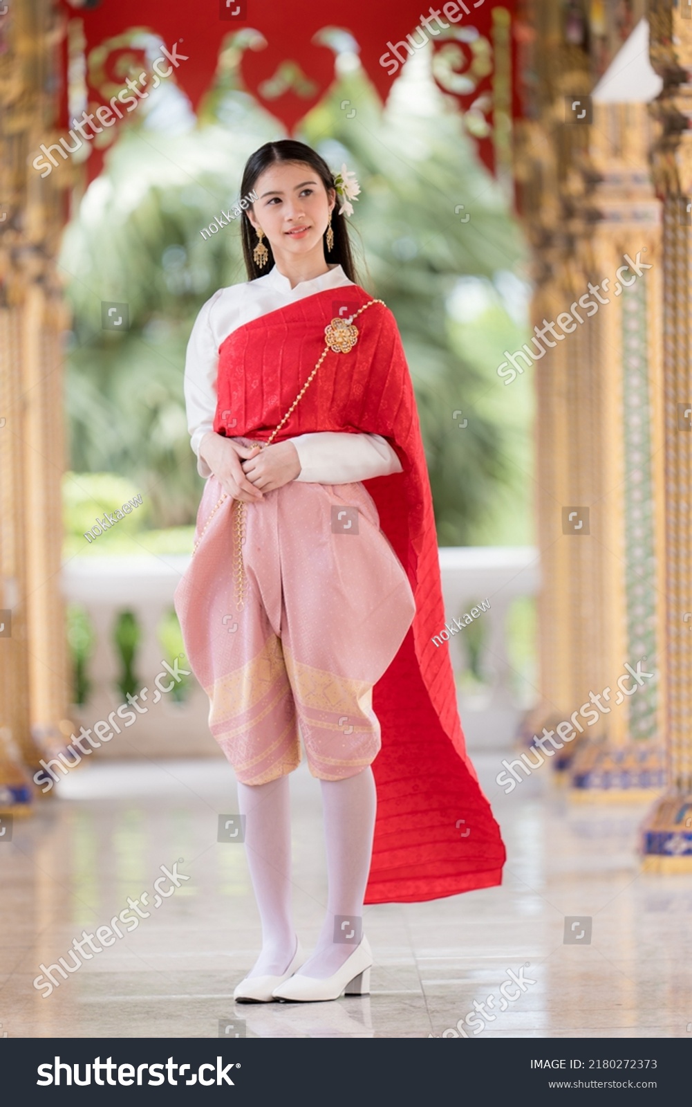 Portrait of a beautiful thai woman wearing a thai dress,Thai girl in retro Thai dress,Beautiful Thai girl in traditional dress costume #2180272373