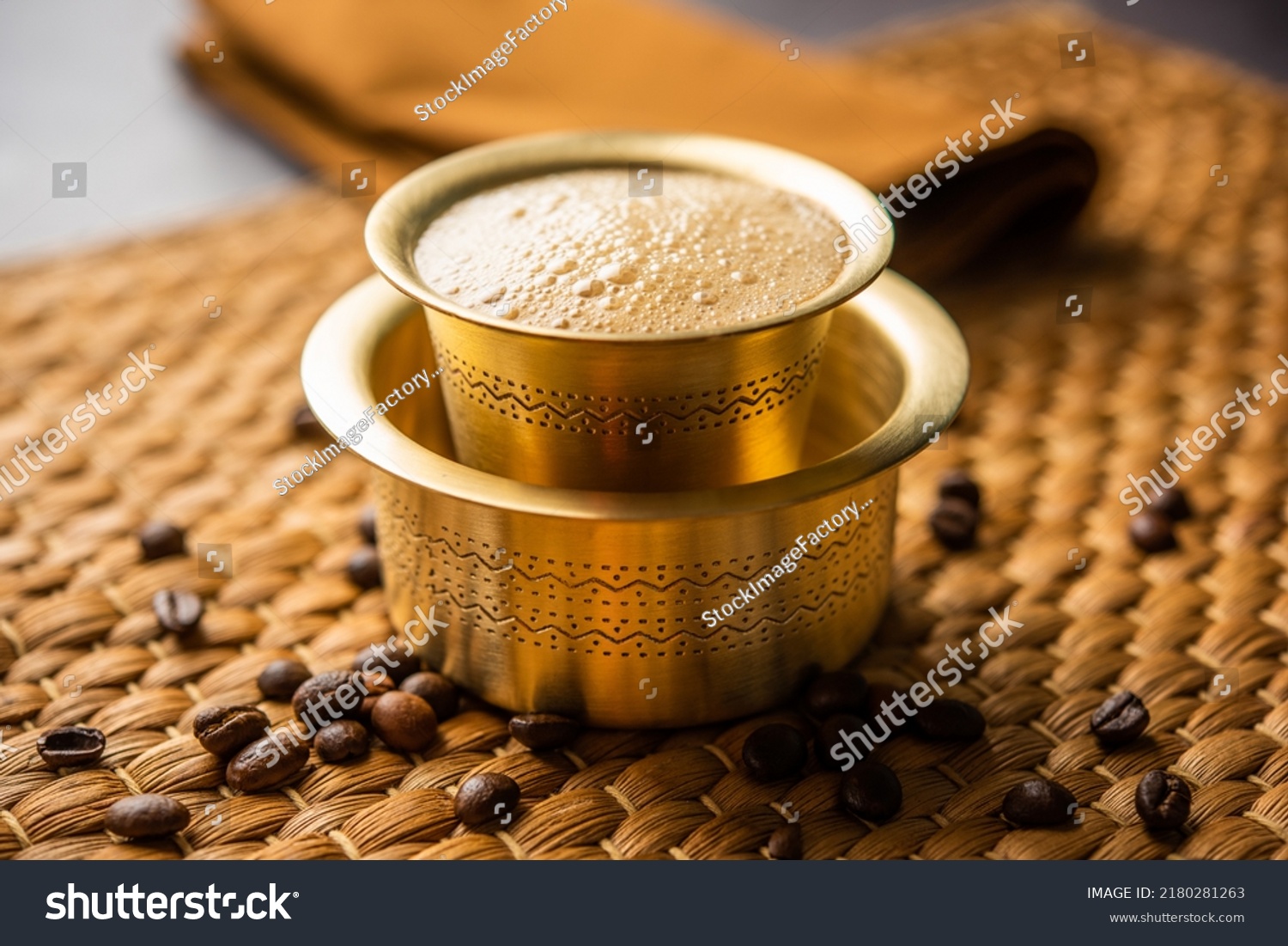 South Indian Filter coffee served in a traditional brass or stainless steel cup #2180281263