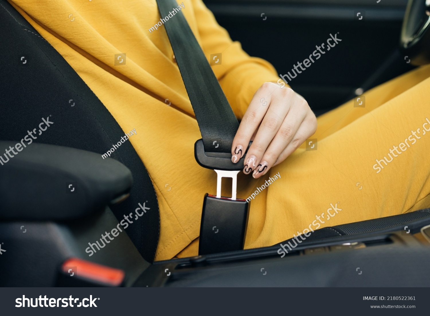 Woman Hand Fastening Car Safety Seat Belt. Protection Road Safety Snap Driving. Driver Fastening Seatbelt In Car. Woman Car Lap Buckling Seat Belt Inside In Vehicle Before Driving. #2180522361