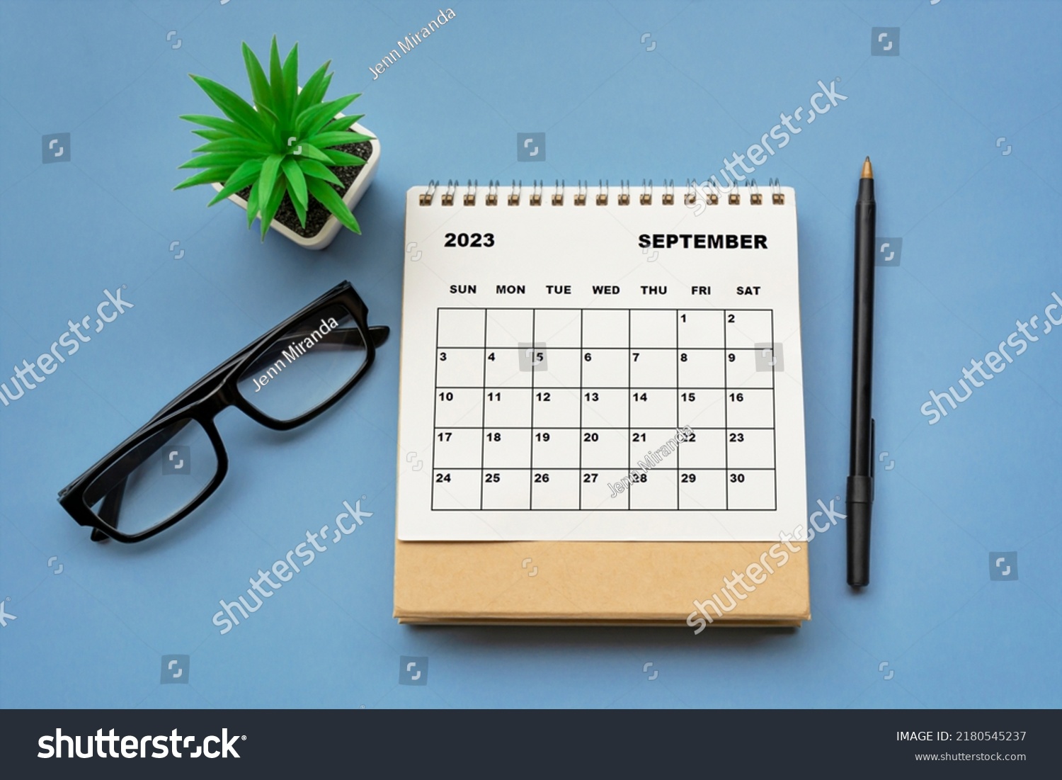September 2023 desk calendar on blue background. Directly above. Flat lay. Copy space. #2180545237