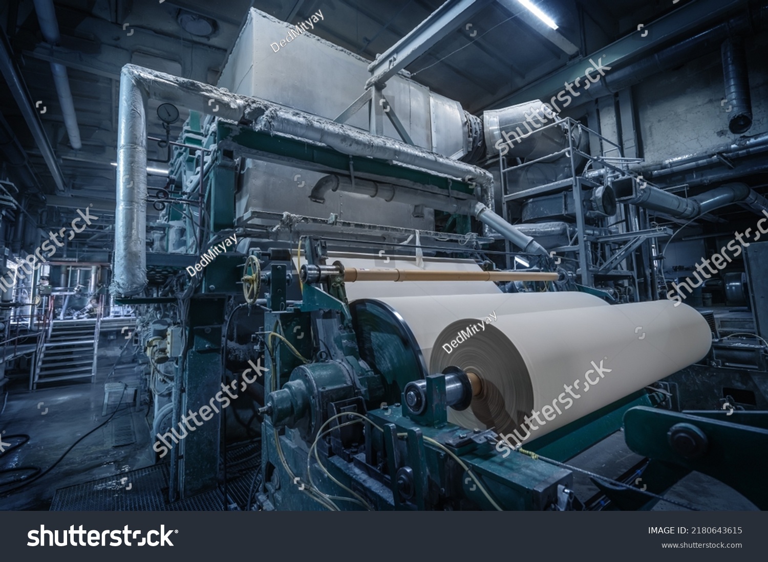 Paper production machine in wastepaper recycling factory. Paper and pulp mill. #2180643615