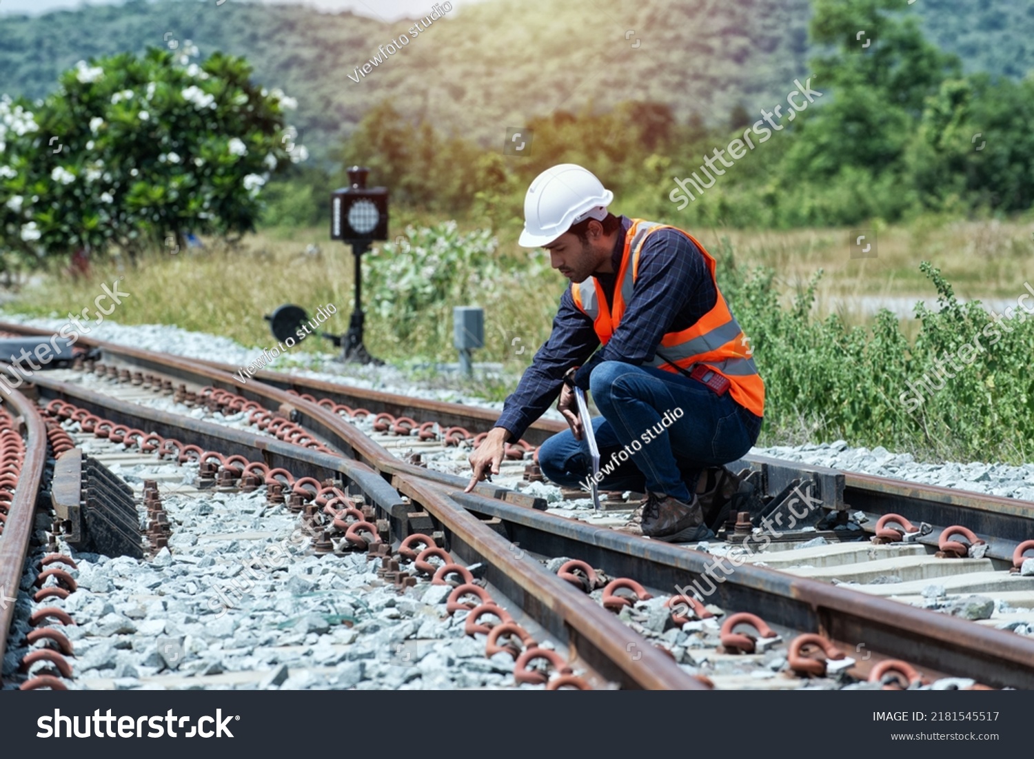 engineer Sitting on railway inspection. construction worker on railways. Engineer work on railway.rail,engineer,Infrastructure #2181545517