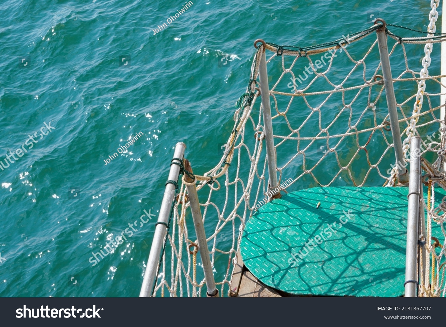 Stairs or walkways on passenger ships which are fenced with nets to maintain the safety of passengers. This photo is just right for shipping safety needs etc.                 #2181867707