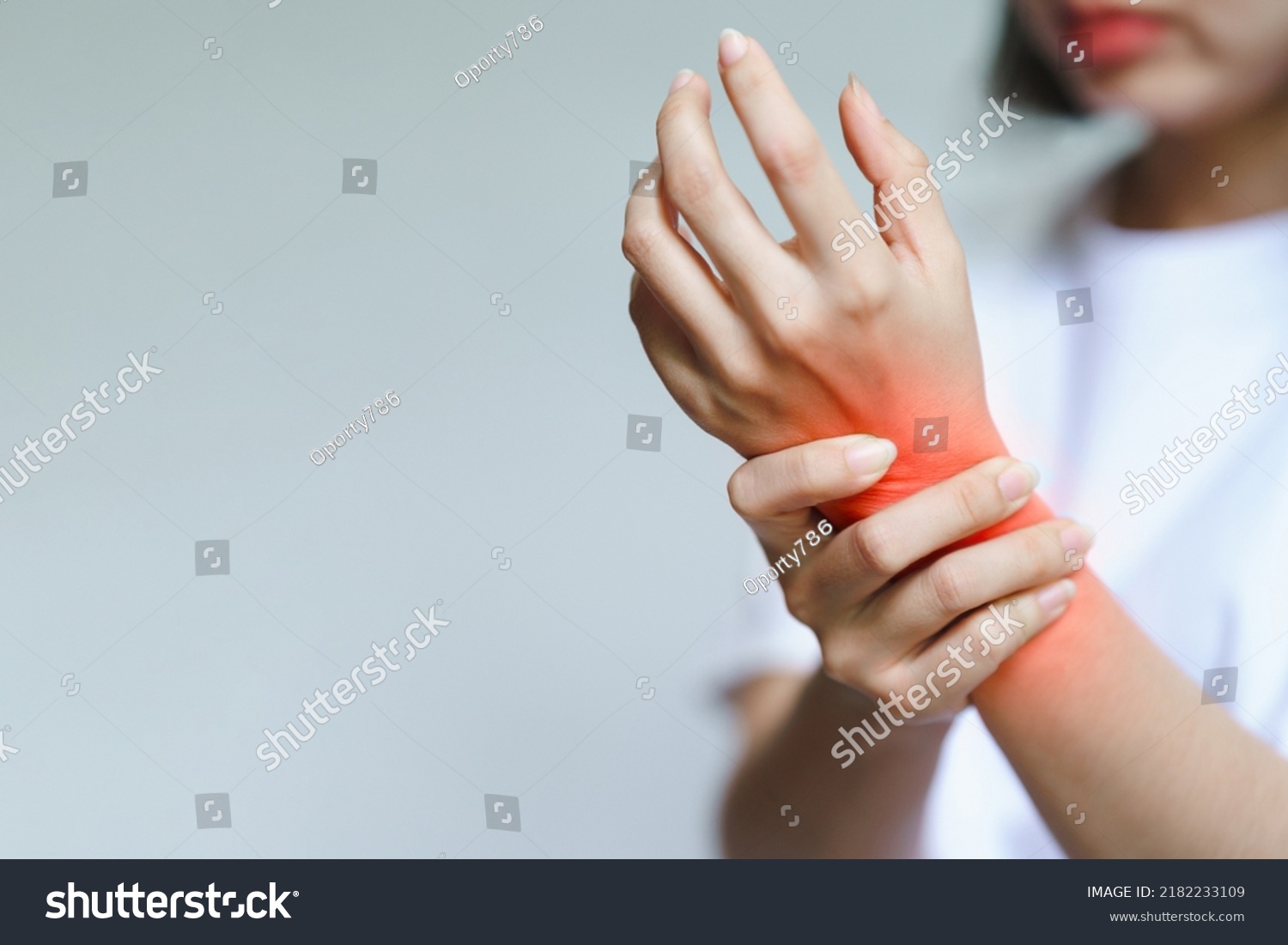 A woman has pain in her wrist. Health care concept. #2182233109