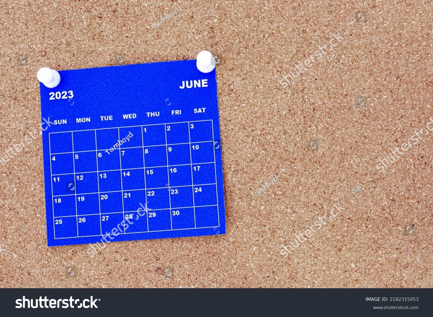 June 2023 blue calendar with pin on cork bulletin billboard. Copy space, #2182315053