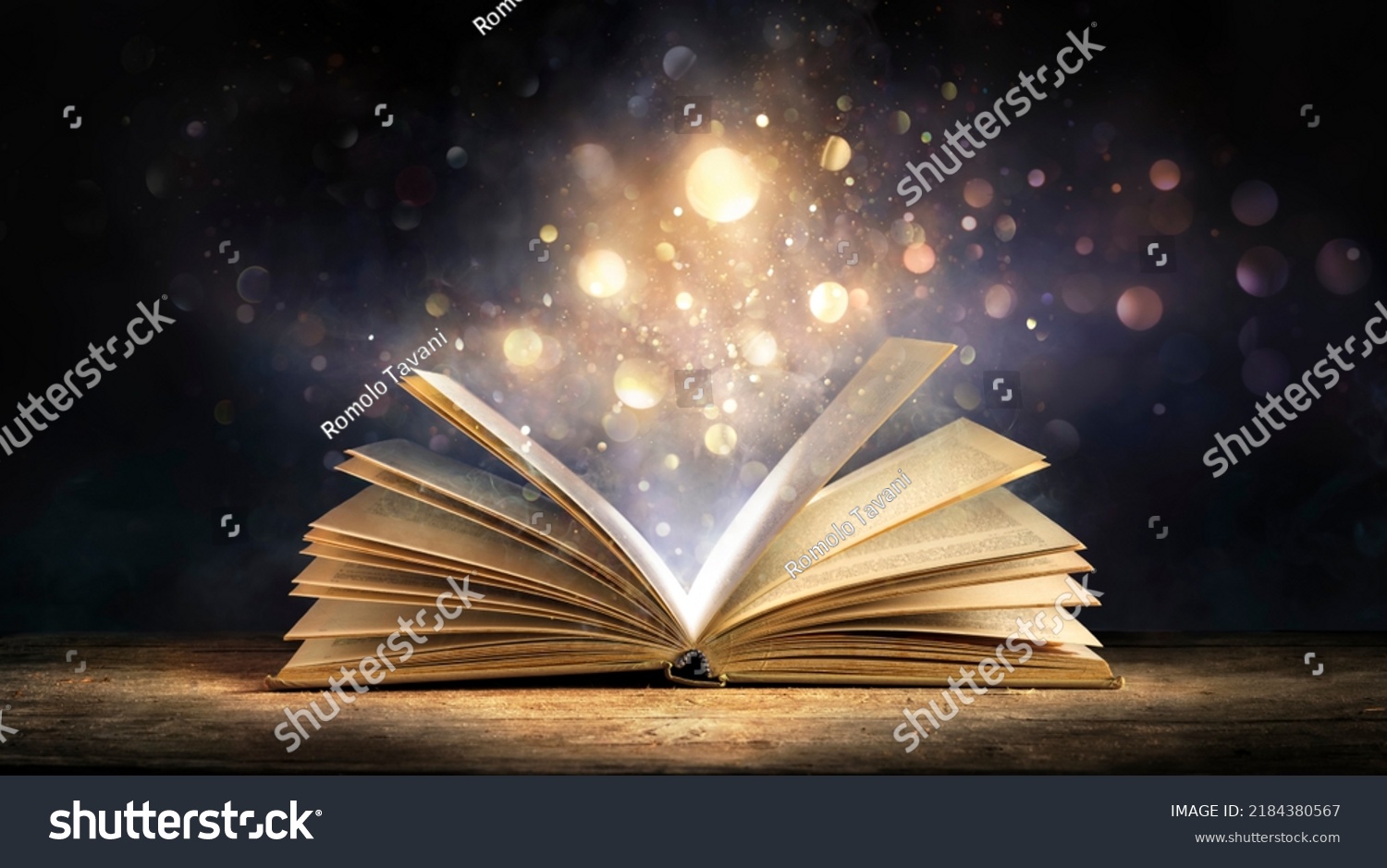 Magic Book With Open Antique Pages And Abstract Bokeh Lights Glowing In Dark Background - Literature And Education Concept #2184380567