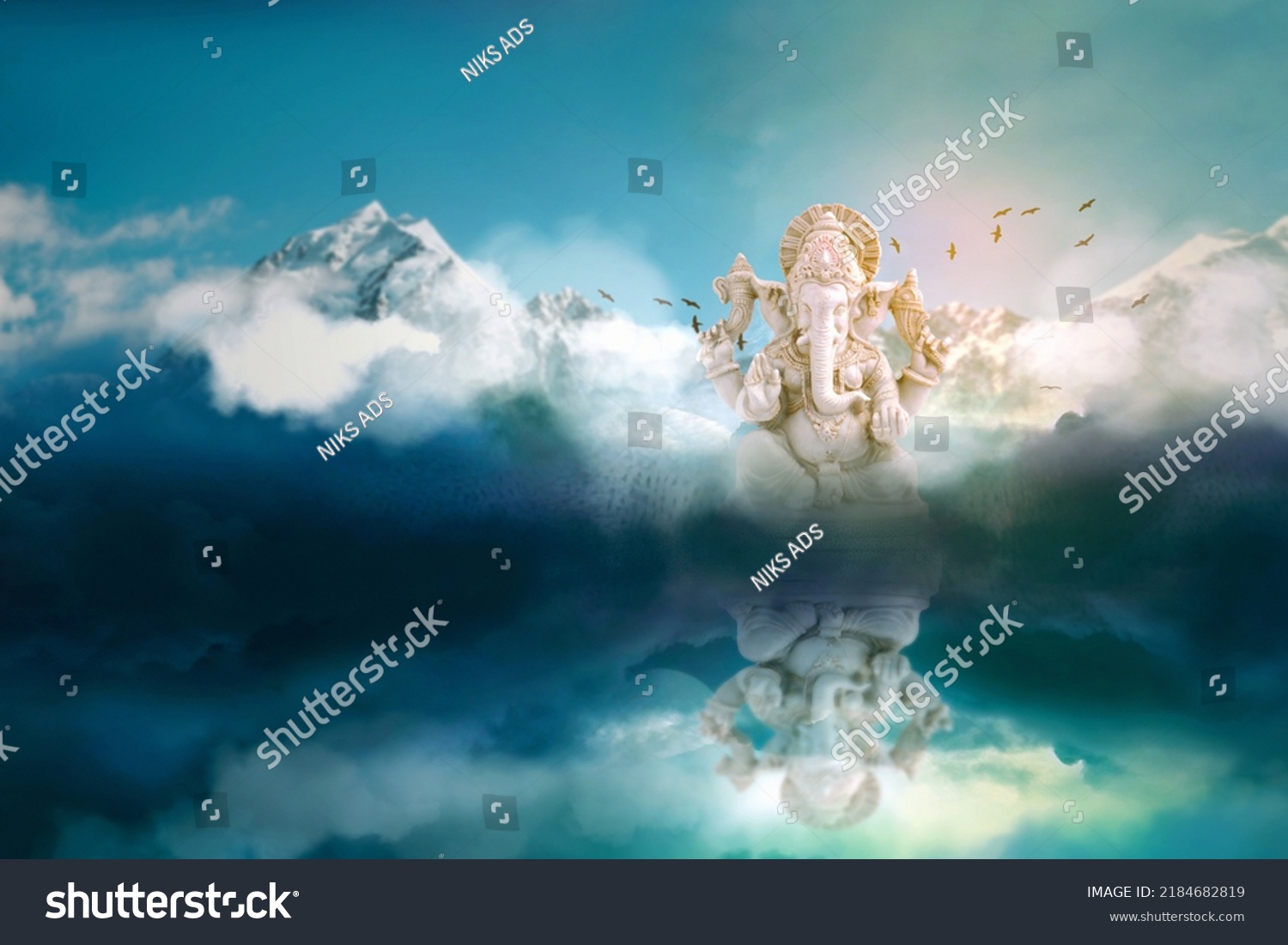 Lord ganesha sculpture on mountain and sky background. #2184682819