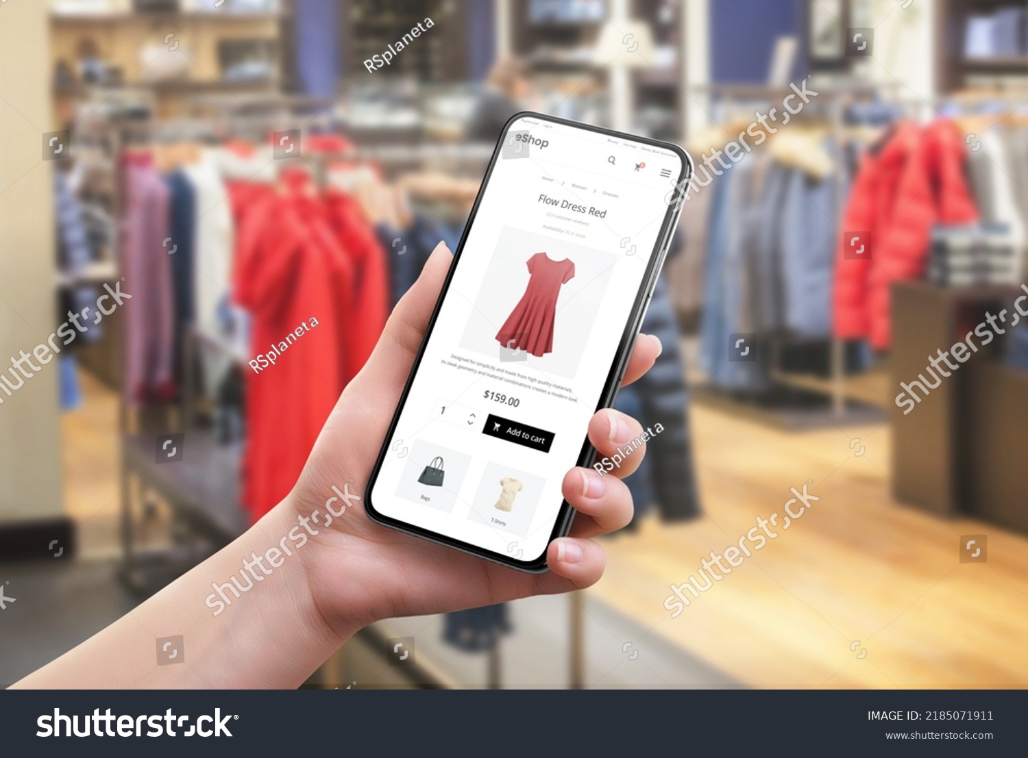 Search for clothes online in a clothing store. Color and size selection on app. Modern e-commerce website on a mobile phone in a woman's hand #2185071911
