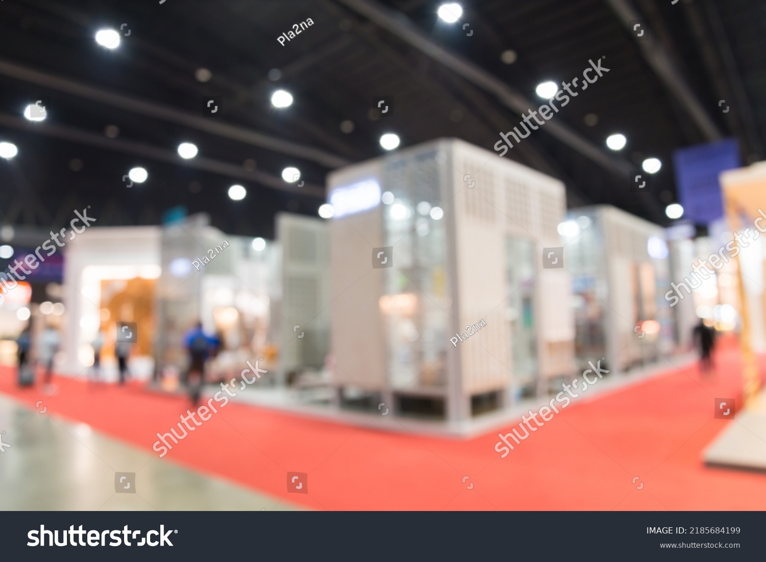 Abstract blur people in exhibition hall event trade show expo background. Home furniture fair expo, business marketing and event fair organizer concept. #2185684199