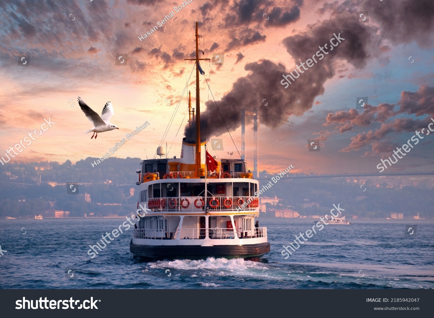 Ferry emitting large amount of black smoke. The ferry cruises in the Bosphorus. Ferry services in the Istanbul Bosphorus. #2185942047