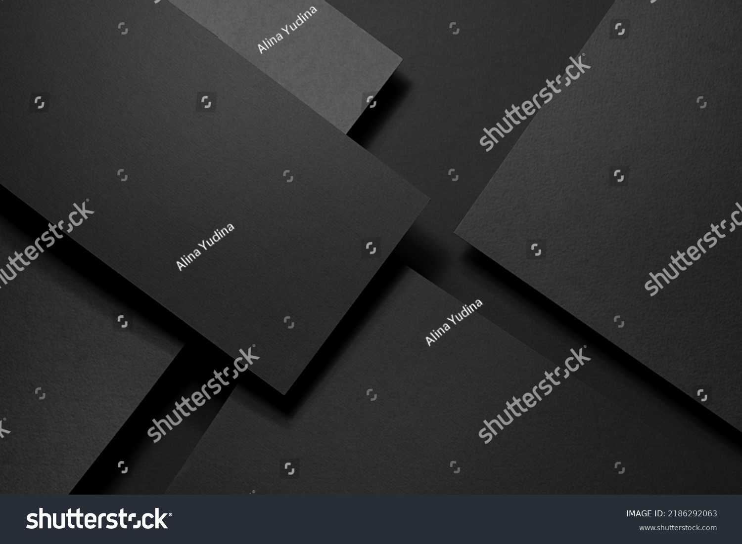 Dark graphite grey abstract textured geometric stepped background with fly rectangle paper sheets, stripe with corner, lines in hard light, black shadows in luxury business style for design, top view. #2186292063
