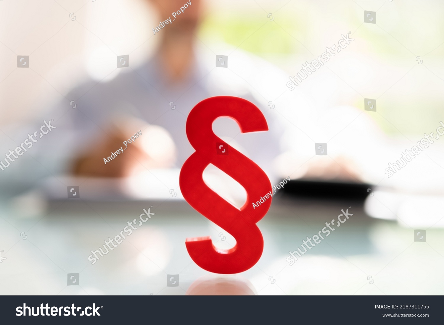 Close-up Of A Red Paragraph Symbol In Front Of Person Working At Workplace #2187311755