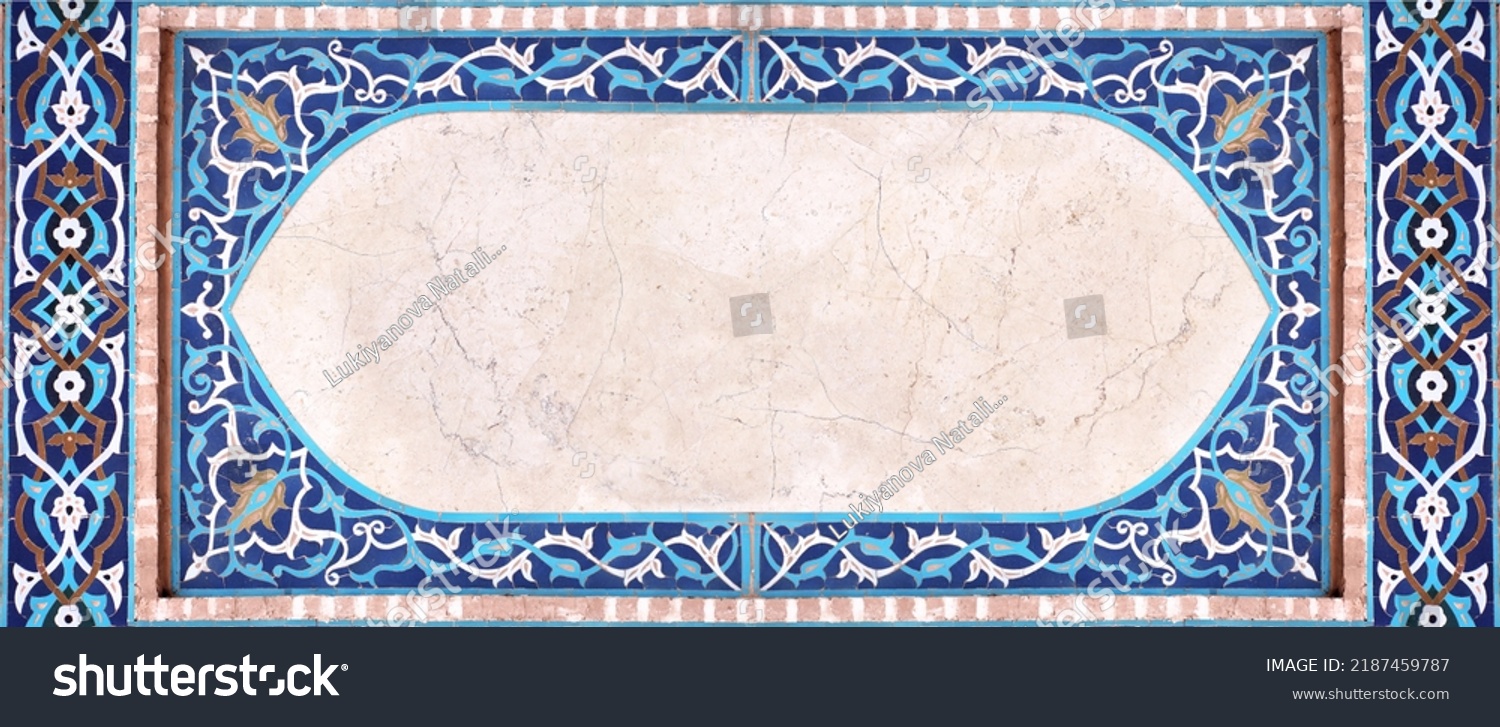 Detail of traditional persian mosaic wall with geometrical and floral ornament, Iran. Horizontal frame with ceramic tile of blue, cian, brown and white colors. Mock up template. Copy space for text #2187459787