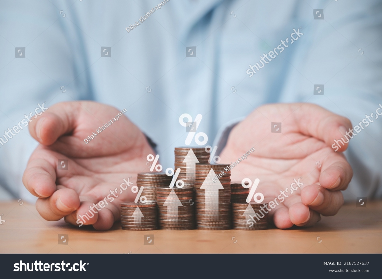 Two hand giving heap of coins money with up arrow and percentage symbol for financial banking increase interest rate or mortgage investment dividend from business growth concept. #2187527637