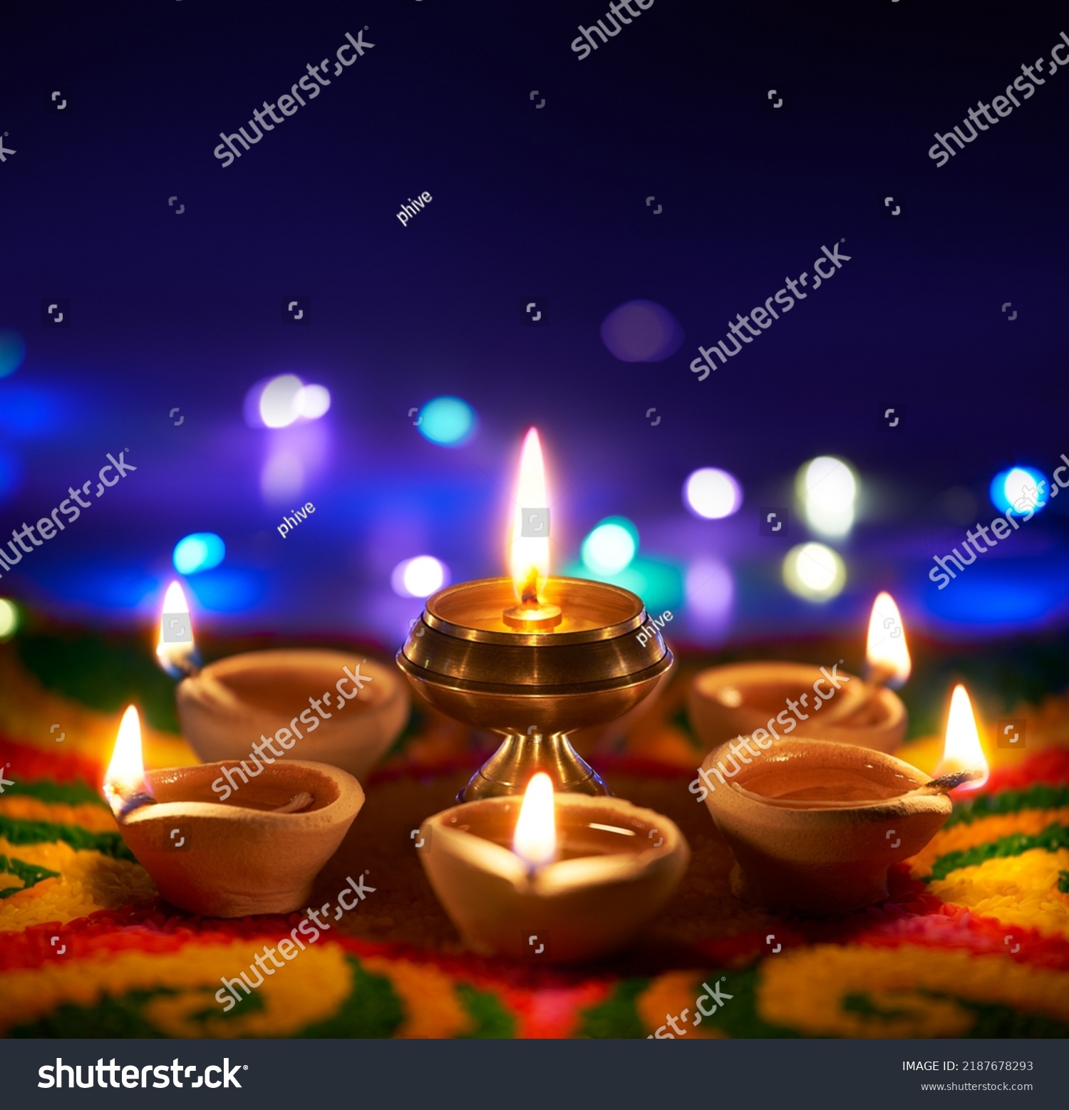 Happy Diwali, Oil lamps lit on colorful rangoli with copy space #2187678293