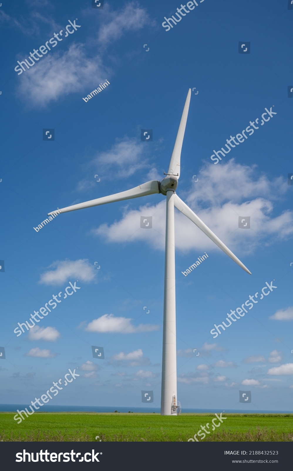 View on modern wind mills, green grain fields and blue Atlantic ocean in agricultural region Pays de Caux in Normandy, France in summer #2188432523